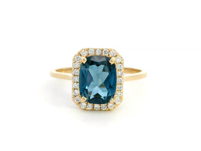 Emerald-cut 2.25-carat London Blue Topaz ring with 0.19-carat diamond accents in 18K yellow gold 