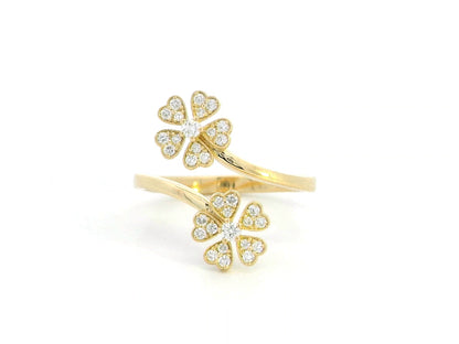 18K gold clover diamond ring with 0.25 carats of natural diamonds in an open, adjustable design. Elegant floral-inspired fine jewelry.