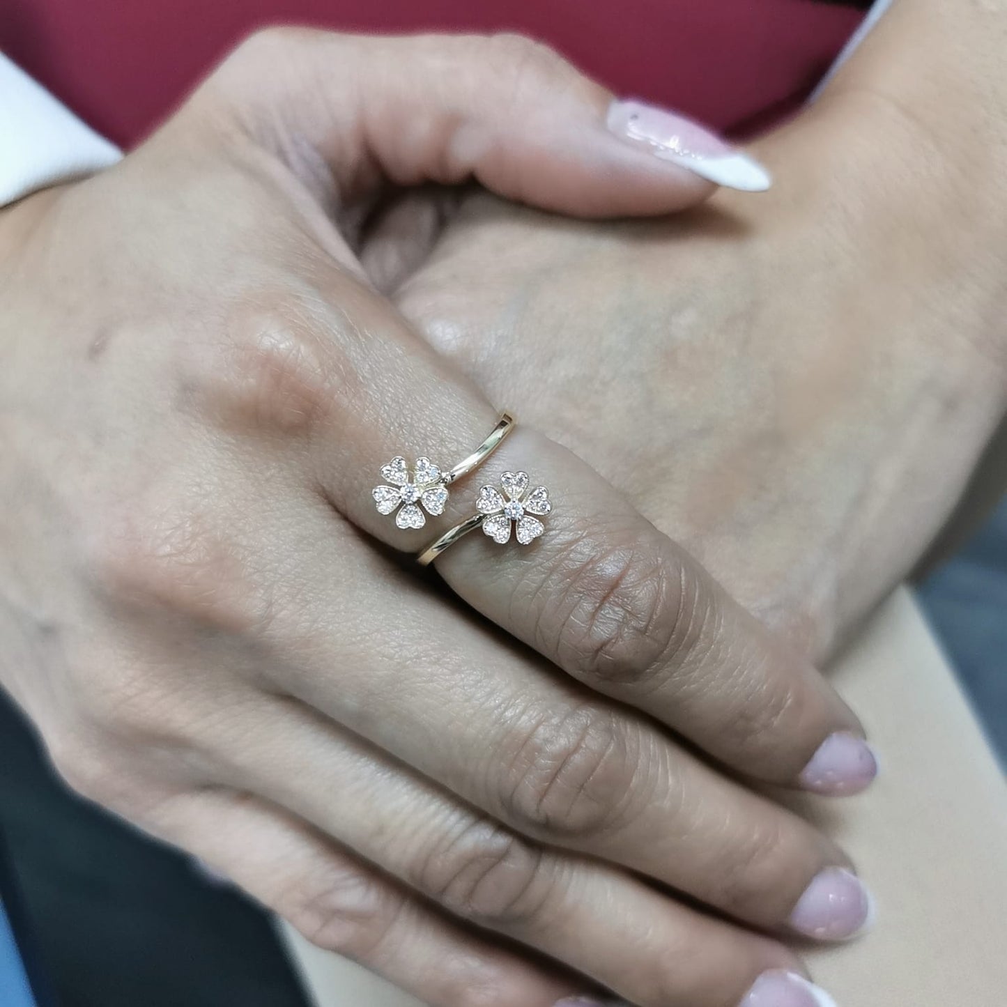 18K gold clover diamond ring with 0.25 carats of natural diamonds in an open, adjustable design. Elegant floral-inspired fine jewelry.