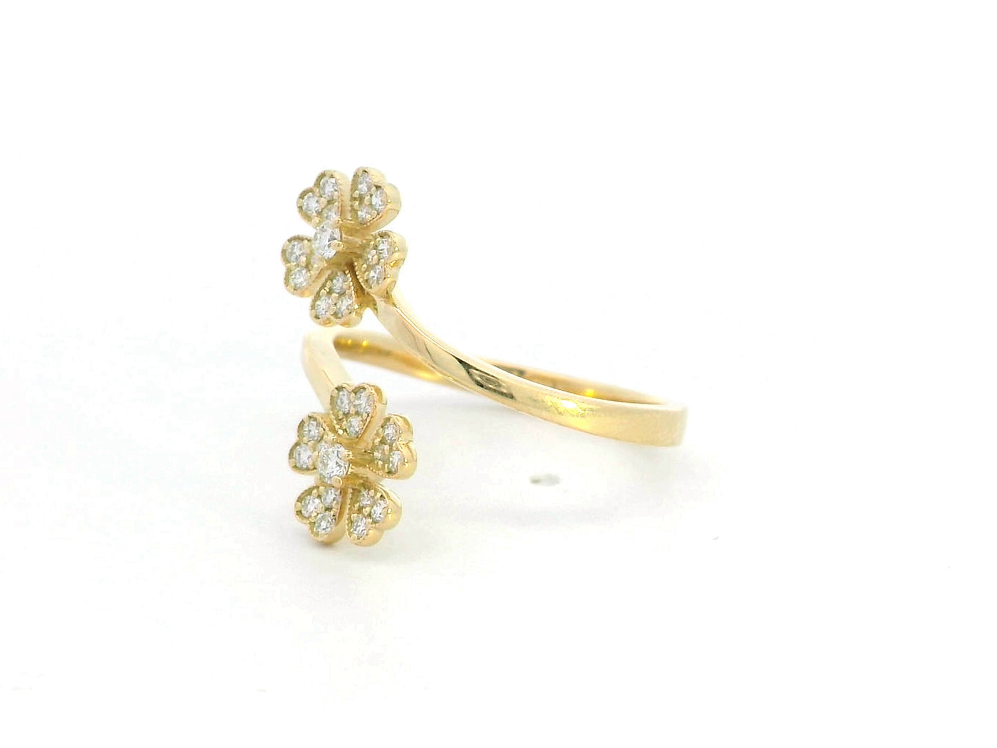 18K gold clover diamond ring with 0.25 carats of natural diamonds in an open, adjustable design. Elegant floral-inspired fine jewelry.