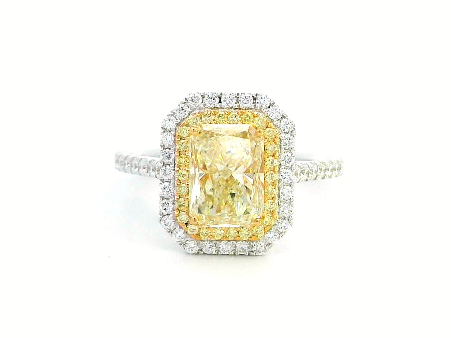 GIA-certified 2.02-carat fancy yellow radiant-cut diamond engagement ring with a double halo of yellow and white diamonds, accent diamonds set on an 18K gold band.