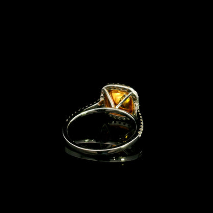 18K white gold engagement ring featuring a 1.50 carat GIA certified natural Fancy Yellow cushion cut diamond surrounded by a yellow diamond inner halo, white diamond outer halo, and diamond pavé band.