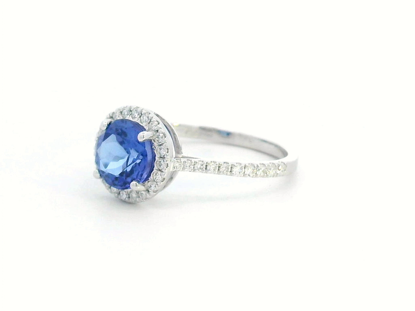 Elegant 1.55-carat round Tanzanite and diamond halo ring in 18K gold – luxury gemstone jewelry