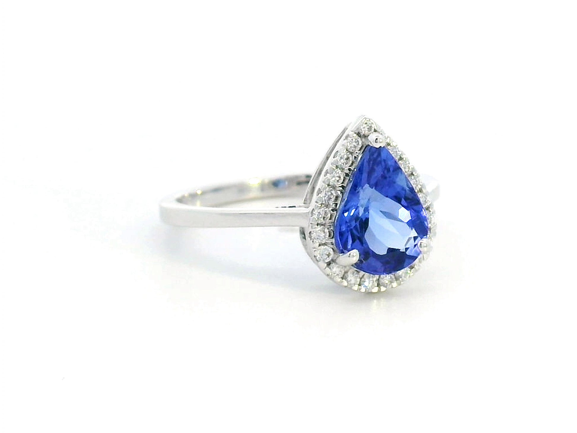 18K gold pear-shaped tanzanite halo ring with 1.60 Ct tanzanite and 0.15 Ct diamond accents, luxury gemstone jewelry