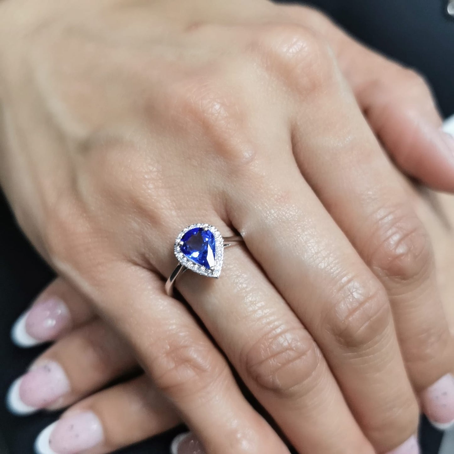 18K gold pear-shaped tanzanite halo ring with 1.60 Ct tanzanite and 0.15 Ct diamond accents, luxury gemstone jewelry