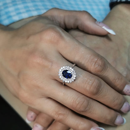 Elegant 2.00 carat sapphire halo ring with 0.53 carats of diamonds, set in 18K white gold. Classic halo design enhances brilliance—perfect as a September birthstone ring.