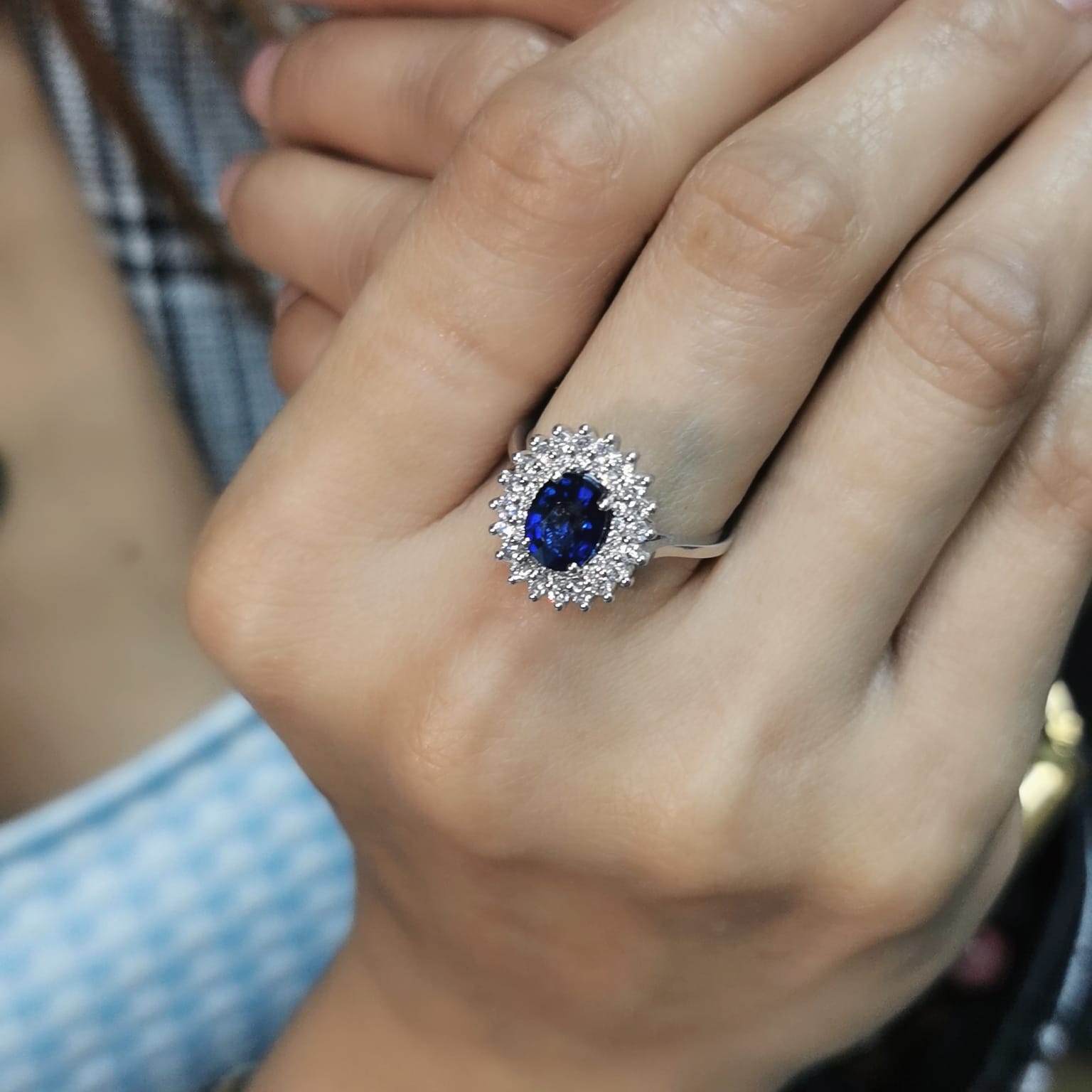 Elegant 2.00 carat sapphire halo ring with 0.53 carats of diamonds, set in 18K white gold. Classic halo design enhances brilliance—perfect as a September birthstone ring.