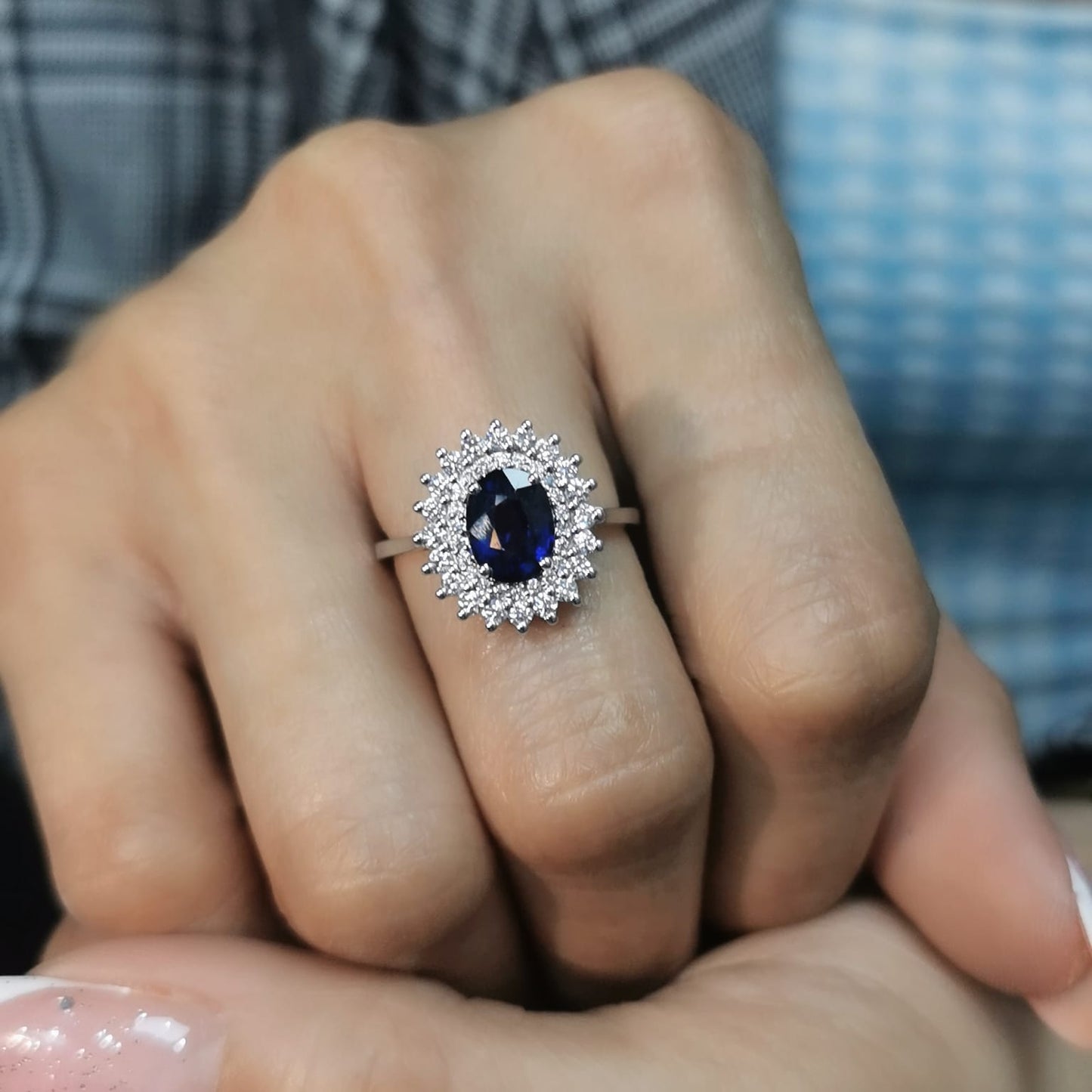 Elegant 2.00 carat sapphire halo ring with 0.53 carats of diamonds, set in 18K white gold. Classic halo design enhances brilliance—perfect as a September birthstone ring.