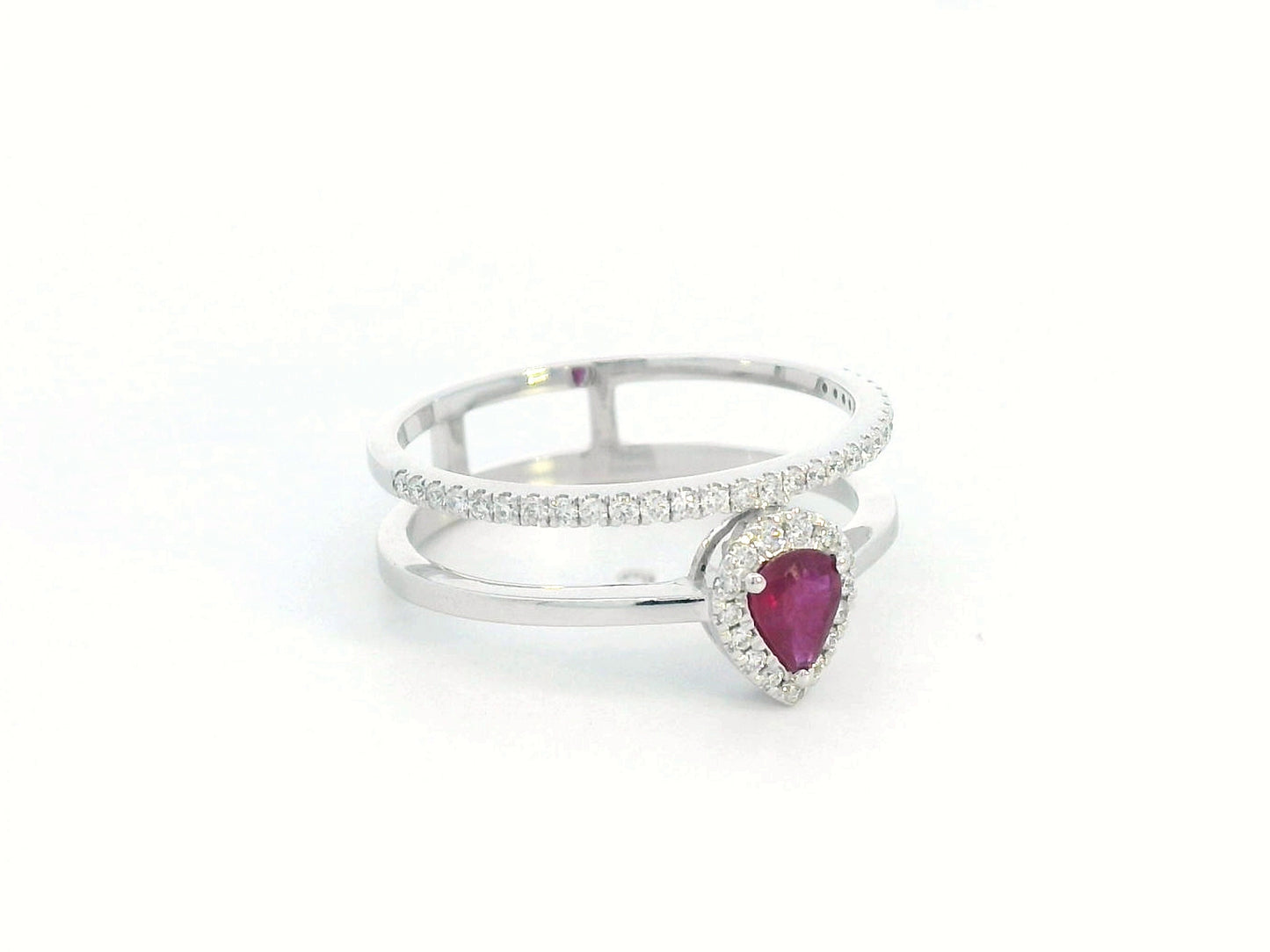 18K gold pear-shaped ruby and diamond ring with double-band design featuring a 0.30-carat ruby and 0.19-carat diamonds.