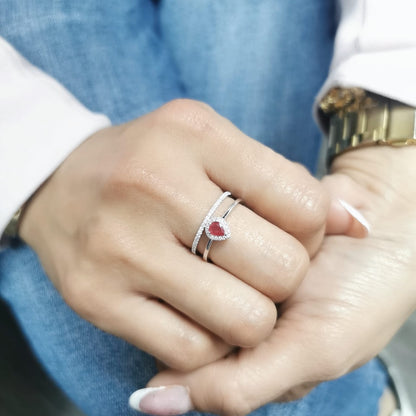 18K gold pear-shaped ruby and diamond ring with double-band design featuring a 0.30-carat ruby and 0.19-carat diamonds.