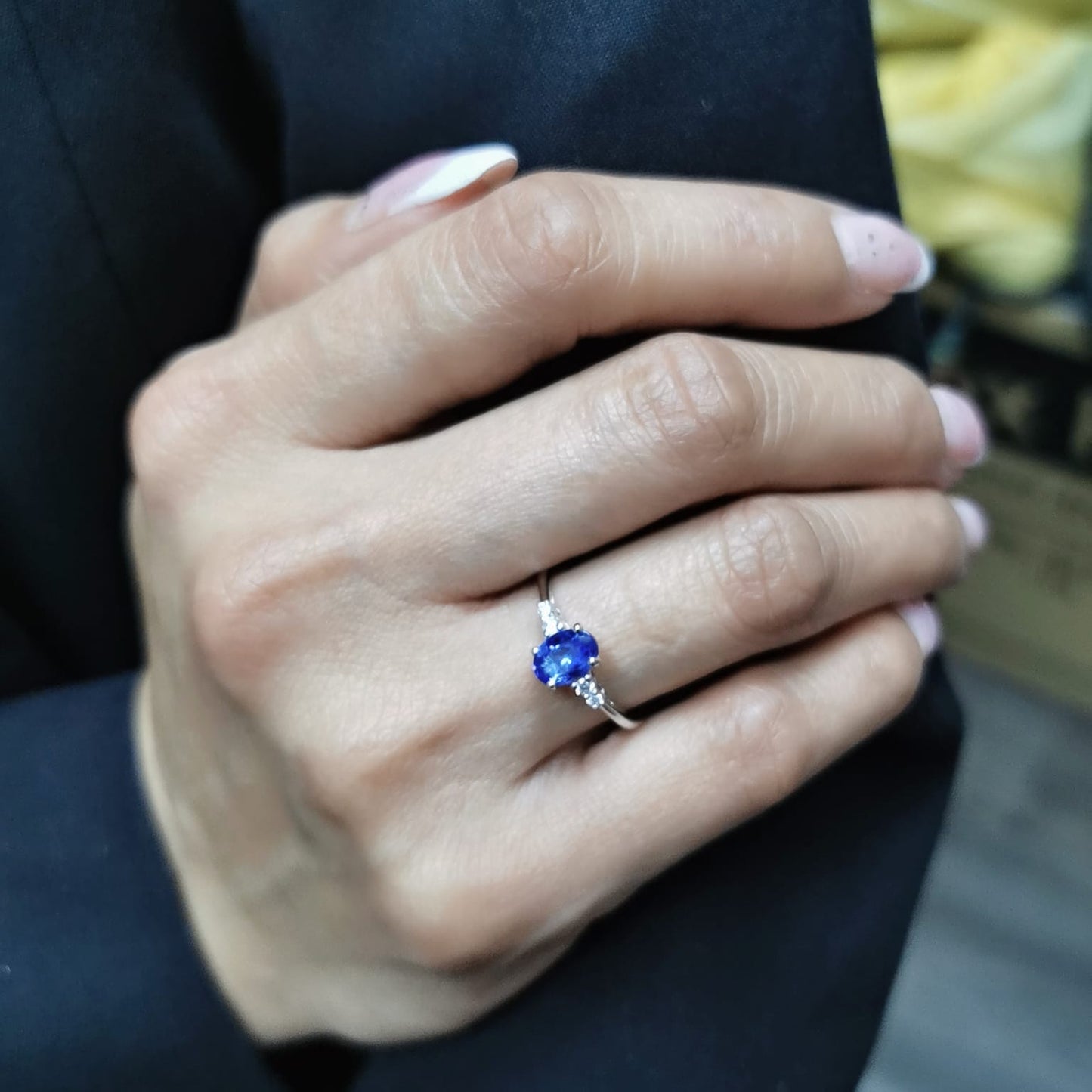 Elegant 0.94-carat oval Tanzanite and 0.10-carat Diamond ring in 18K white gold, perfect for engagements, anniversaries, and December birthstone jewelry