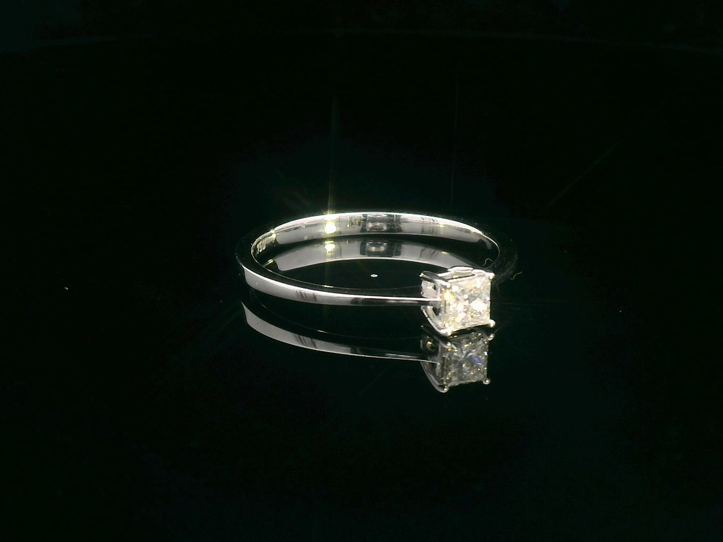 0.23 Carat Princess Cut Diamond Solitaire Ring in 18K White Gold with a classic four-prong setting – perfect for engagements and anniversaries.