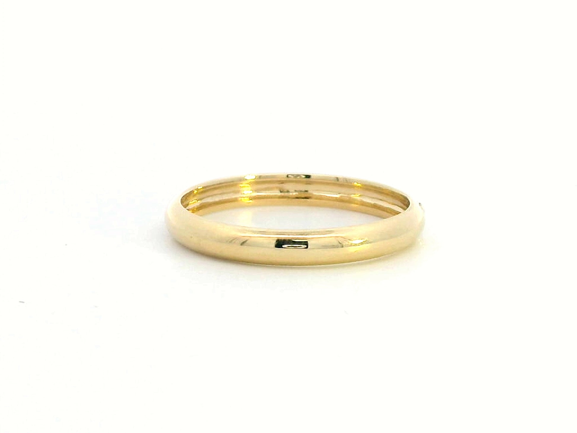 Minimalist 18K gold stackable ring with a 0.05-carat flush-set diamond, perfect as a wedding band, promise ring, or everyday stacking ring.