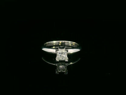 18K white gold solitaire ring with a 0.77ct princess-cut diamond, IGI certified, elegant minimalist engagement design by Emirates Diamonds.
