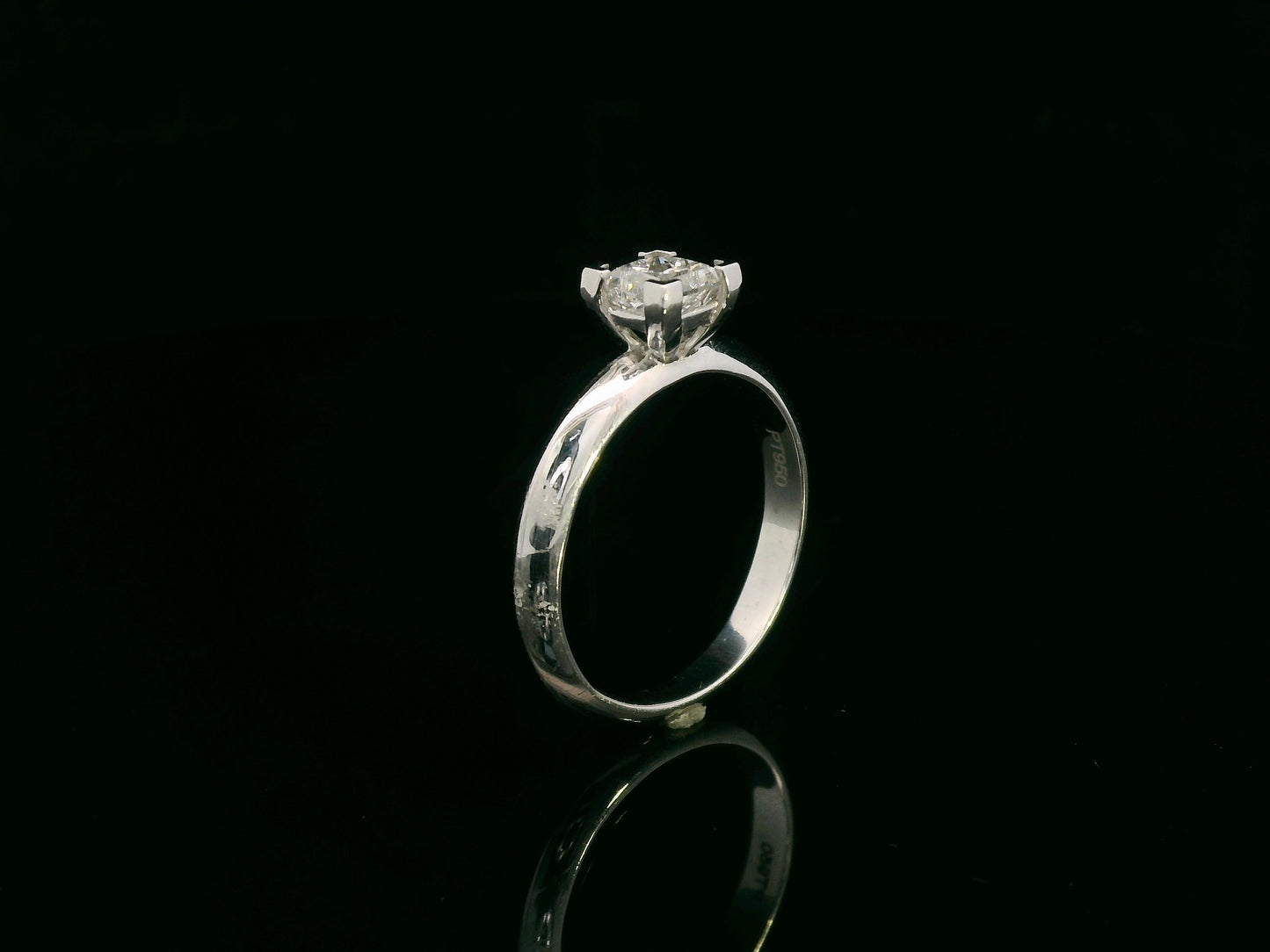 18K white gold solitaire ring with a 0.77ct princess-cut diamond, IGI certified, elegant minimalist engagement design by Emirates Diamonds.