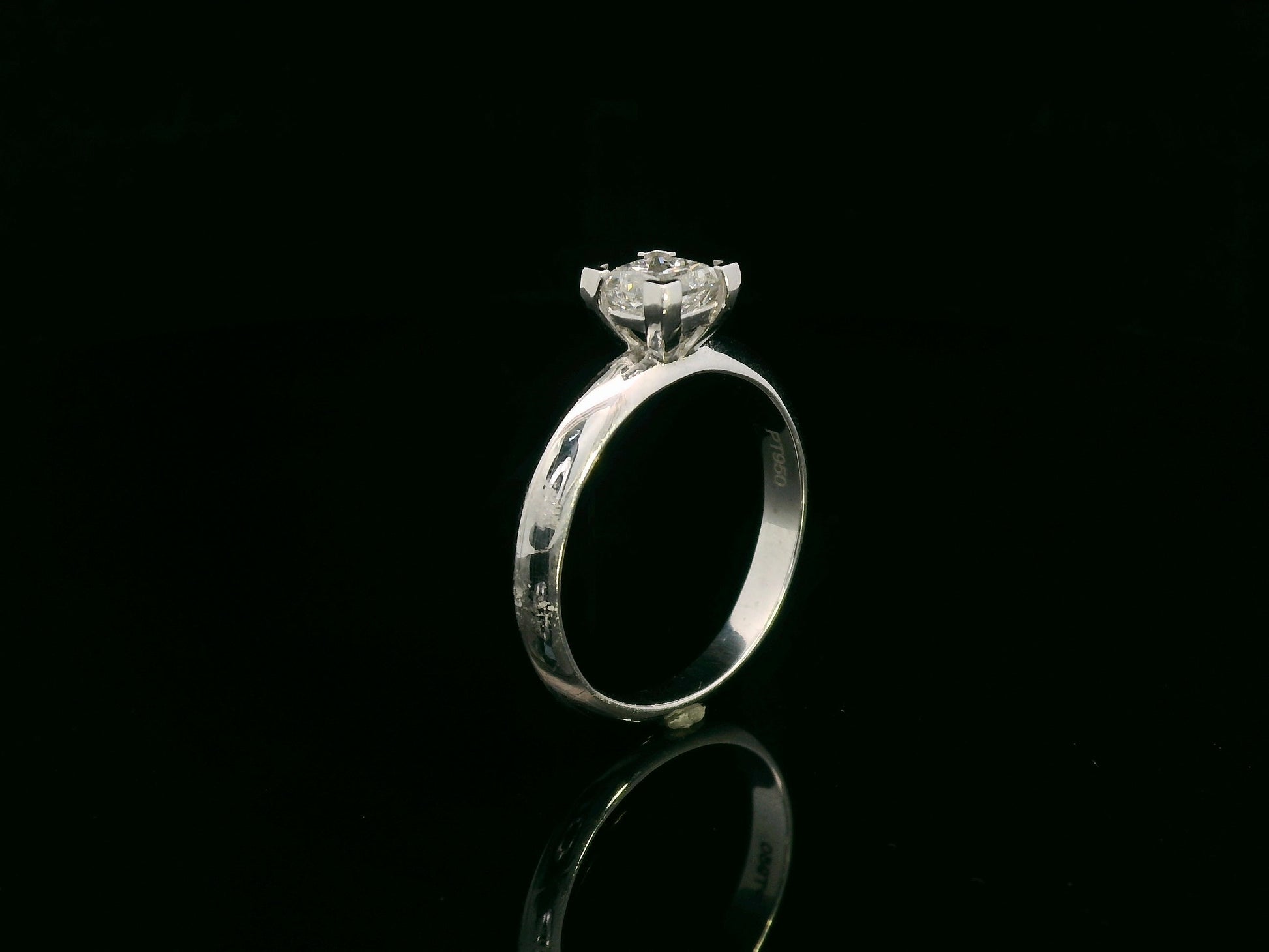 18K white gold solitaire ring with a 0.77ct princess-cut diamond, IGI certified, elegant minimalist engagement design by Emirates Diamonds.