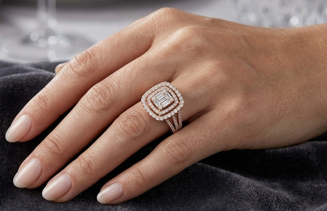Rose gold diamond ring featuring a rectangular baguette diamond arrangement, double round diamond halo and split shoulders