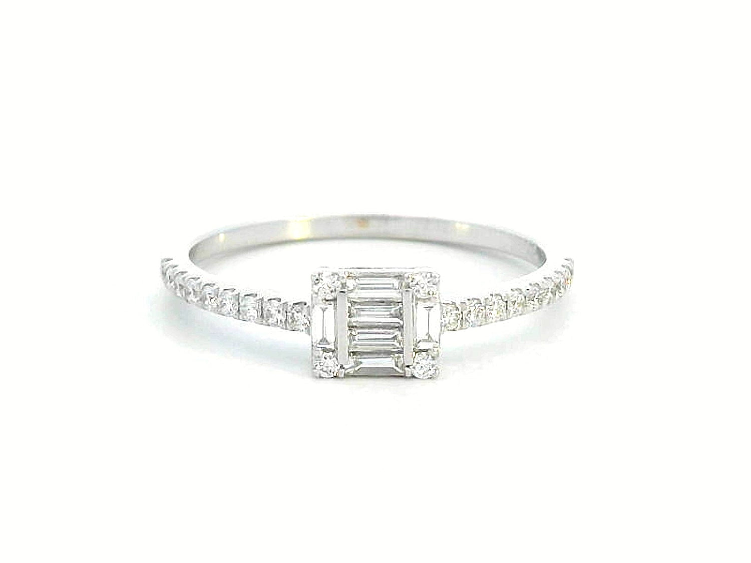 Delicate 18K gold ring featuring 0.28 carats of round and baguette diamonds, set on a slim, diamond-studded band. A timeless piece for any occasion