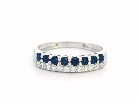 Elegant 18K gold sapphire and diamond ring featuring 0.54 carats of deep blue sapphires and 0.19 carats of brilliant diamonds. A timeless stacking band for weddings, anniversaries, and daily elegance.