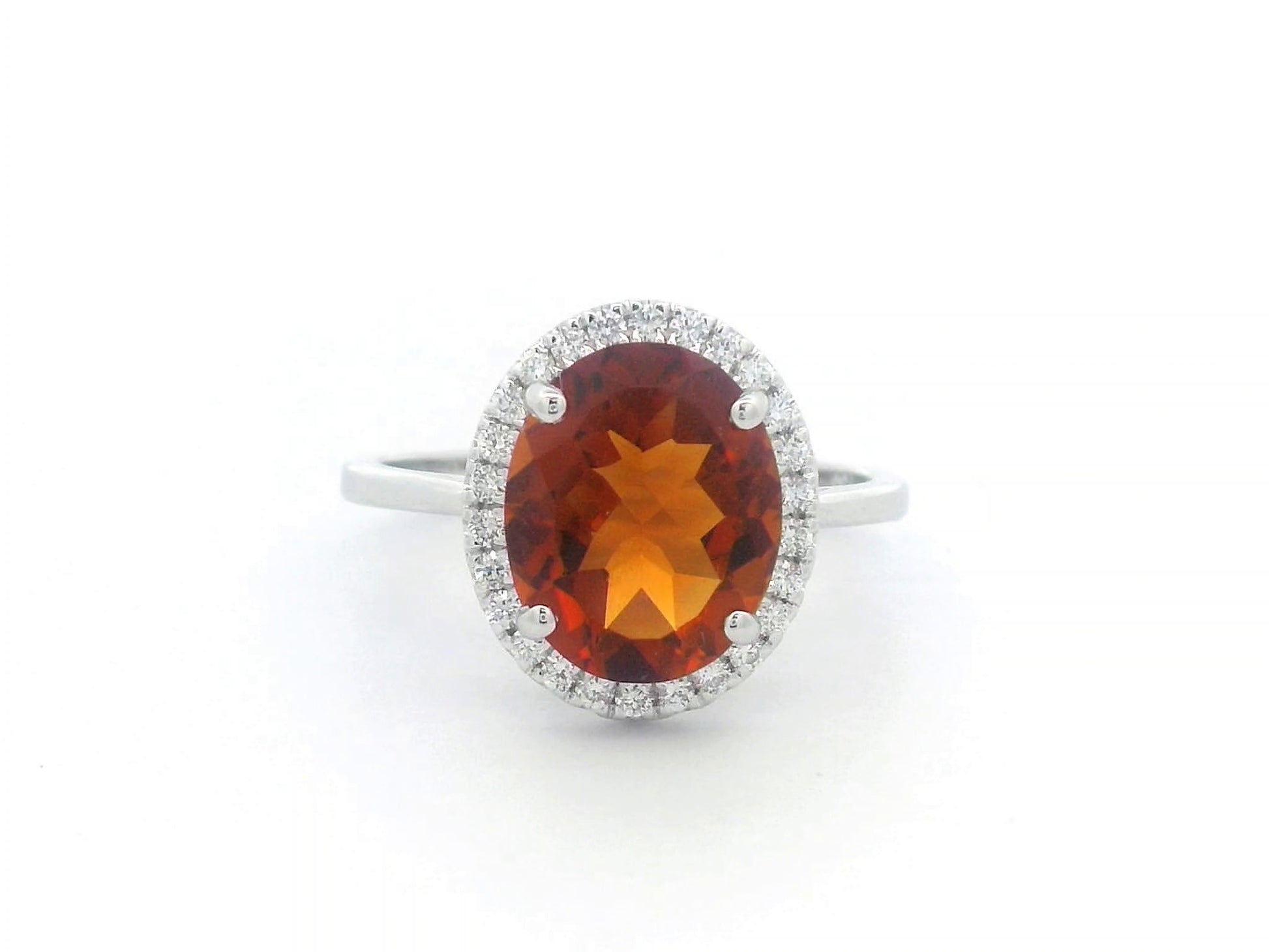 18K white gold ring with oval citrine center stone and round diamond halo