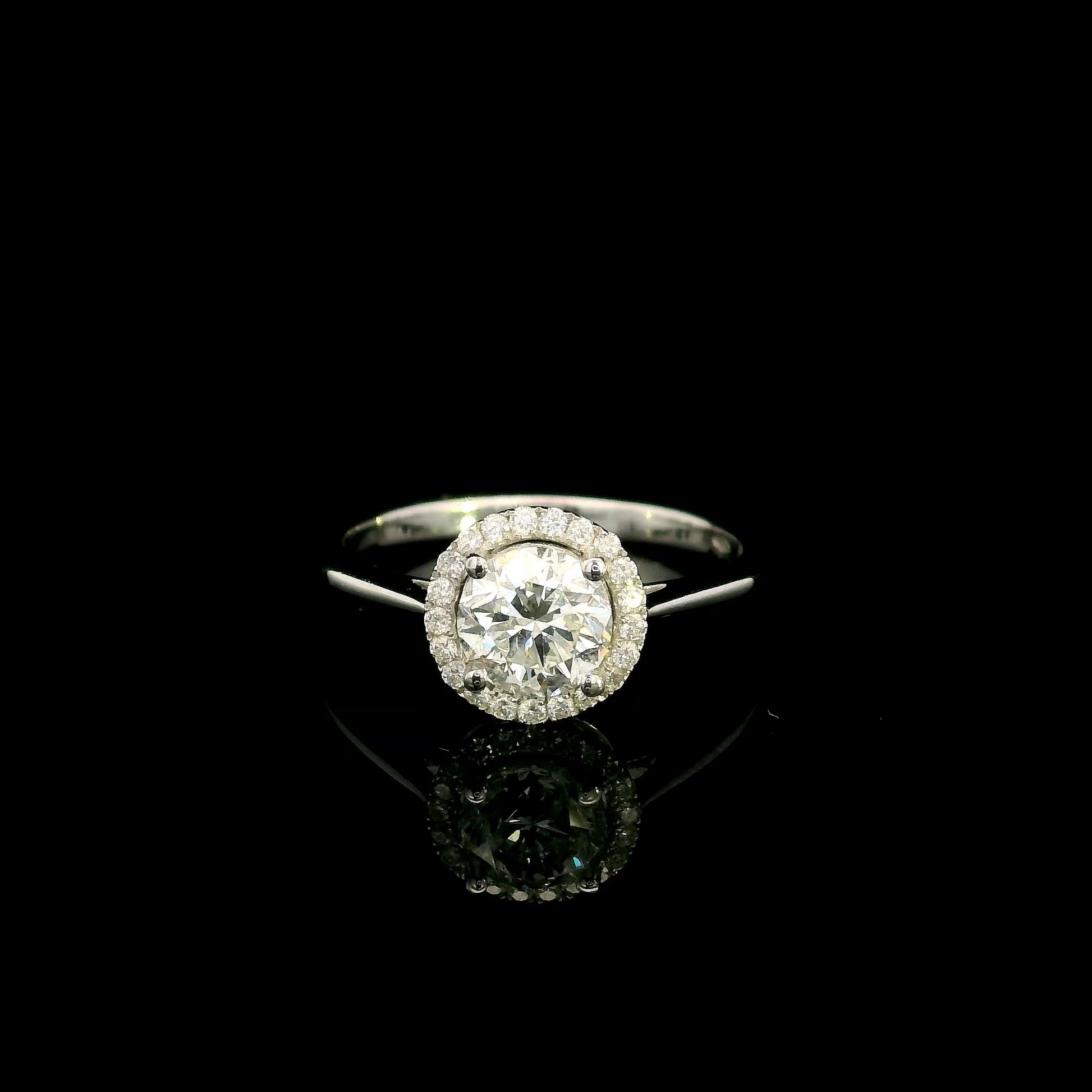 18K white gold round diamond halo engagement ring with a 0.98 carat IGI certified centre diamond and sparkling diamond halo.