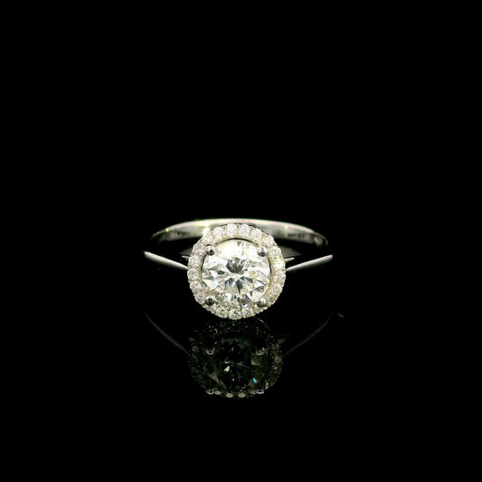 18K white gold round diamond halo engagement ring with a 0.98 carat IGI certified centre diamond and sparkling diamond halo.