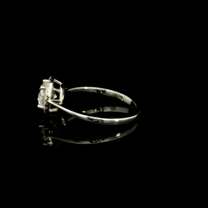 18K white gold round diamond halo engagement ring with a 0.98 carat IGI certified centre diamond and sparkling diamond halo.