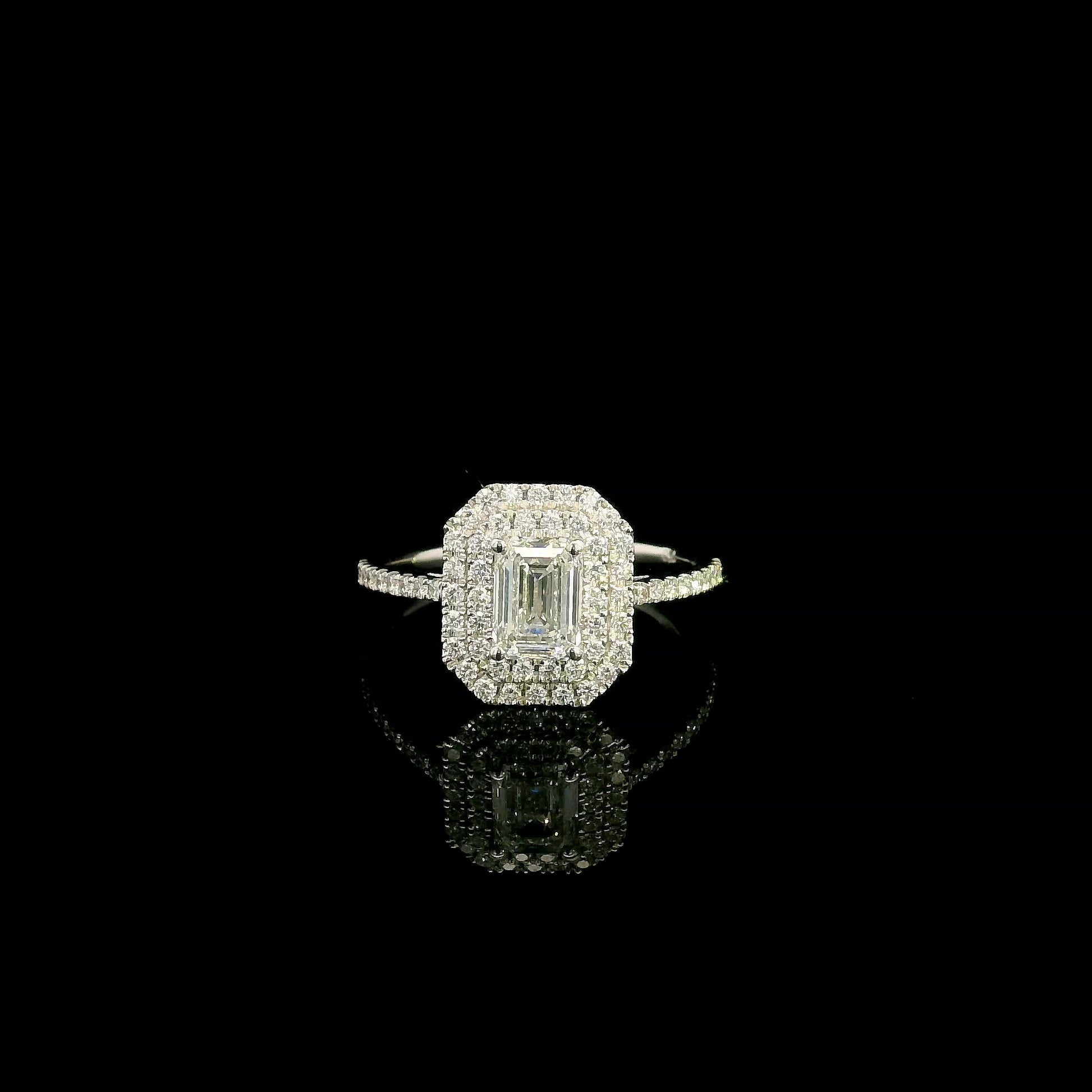 18K white gold halo engagement ring featuring a 1.00 carat GIA certified natural emerald cut diamond with VVS2 clarity and E colour, surrounded by a double halo and 0.43 carat natural round brilliant diamonds.