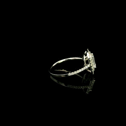 18K white gold halo engagement ring featuring a 1.00 carat GIA certified natural emerald cut diamond with VVS2 clarity and E colour, surrounded by a double halo and 0.43 carat natural round brilliant diamonds.