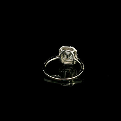 18K white gold halo engagement ring featuring a 1.00 carat GIA certified natural emerald cut diamond with VVS2 clarity and E colour, surrounded by a double halo and 0.43 carat natural round brilliant diamonds.