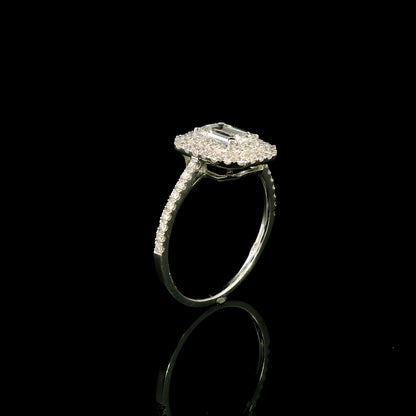 18K white gold halo engagement ring featuring a 1.00 carat GIA certified natural emerald cut diamond with VVS2 clarity and E colour, surrounded by a double halo and 0.43 carat natural round brilliant diamonds.