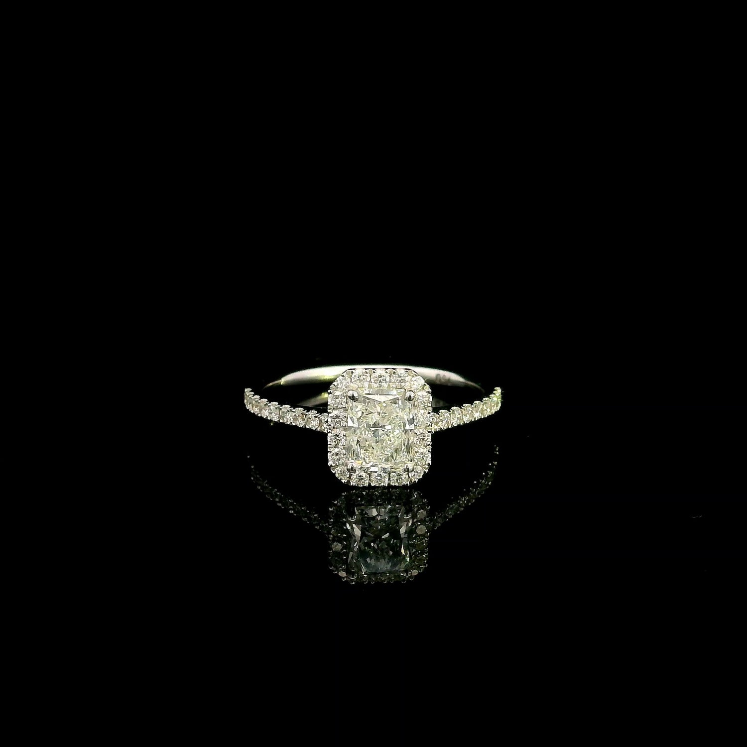 18K white gold radiant cut diamond halo engagement ring featuring a 1.01 carat GIA certified natural diamond with a diamond halo and pavé band.