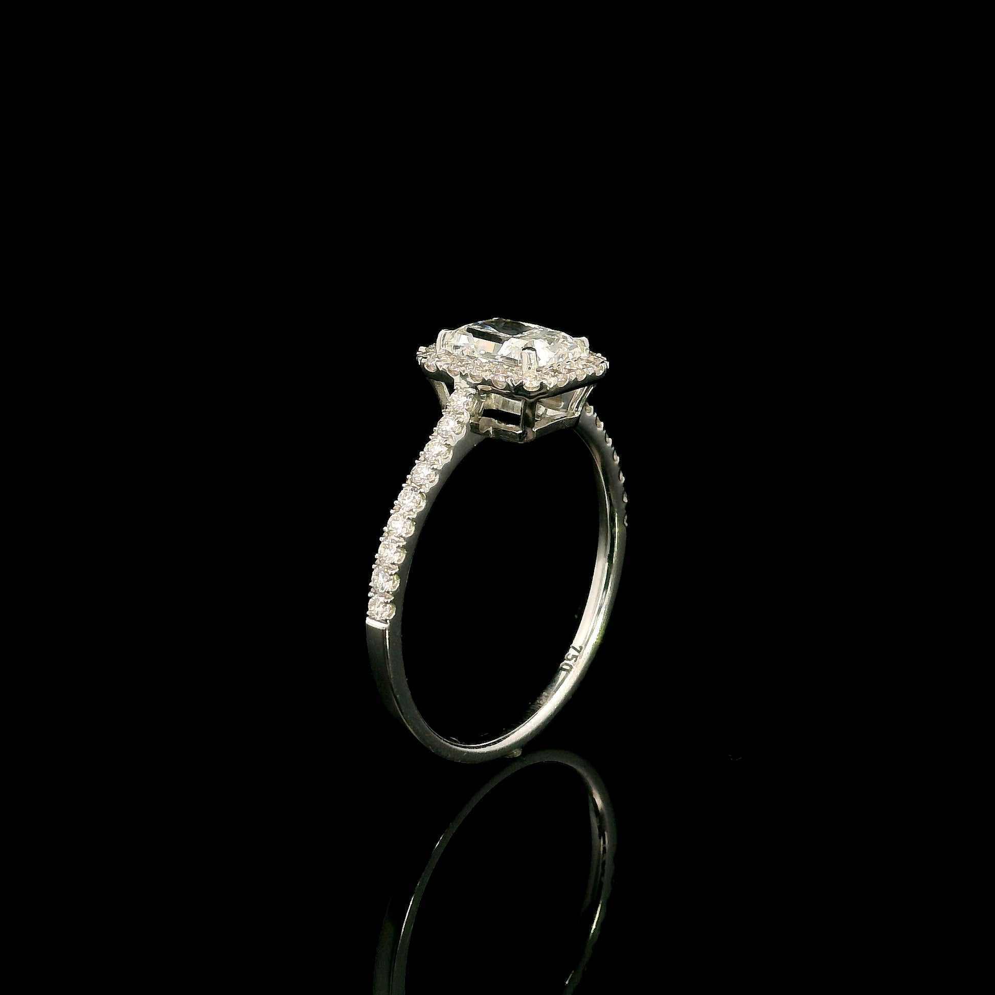 18K white gold radiant cut diamond halo engagement ring featuring a 1.01 carat GIA certified natural diamond with a diamond halo and pavé band.