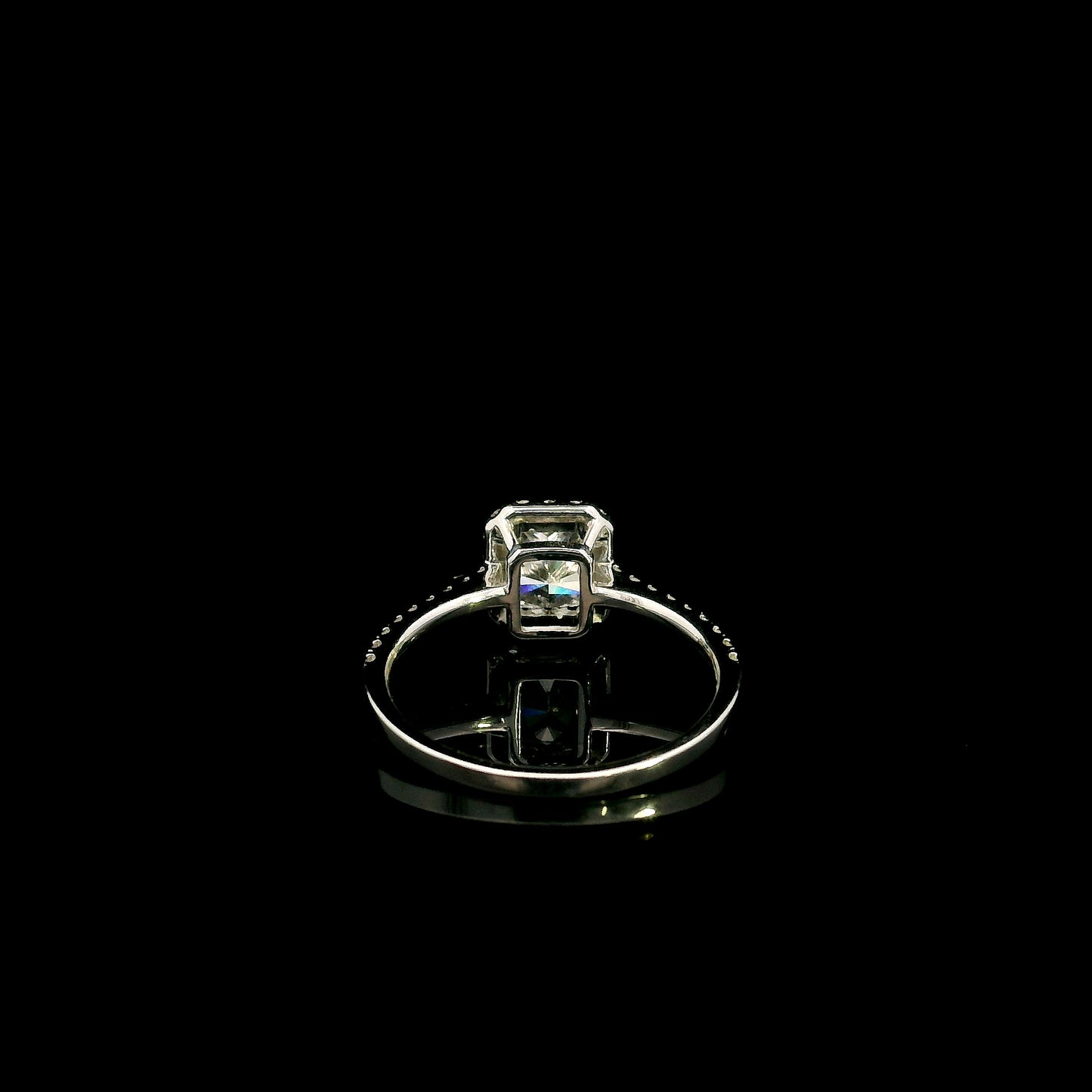 18K white gold radiant cut diamond halo engagement ring featuring a 1.01 carat GIA certified natural diamond with a diamond halo and pavé band.