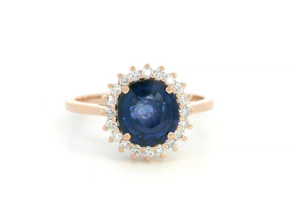 Blue sapphire and diamond halo ring in 18K rose gold with 2.02 carat sapphire and vintage-inspired setting