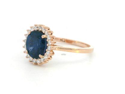 Blue sapphire and diamond halo ring in 18K rose gold with 2.02 carat sapphire and vintage-inspired setting