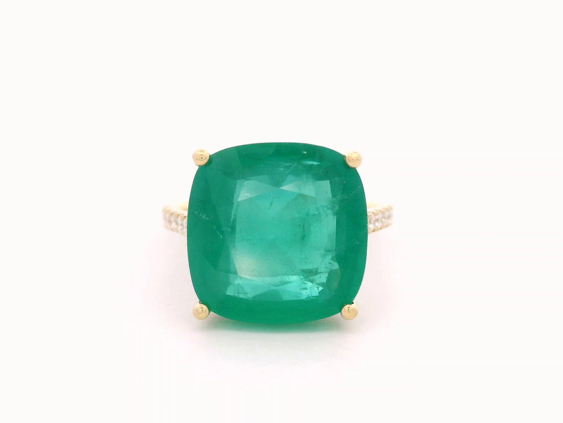 9.01 carat cushion-cut emerald ring in 18K yellow gold with hidden halo and diamond pavé band