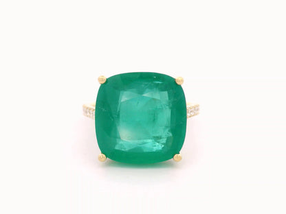 9.01 carat cushion-cut emerald ring in 18K yellow gold with hidden halo and diamond pavé band