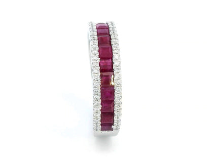 18K gold ruby and diamond ring with 1.36ct baguette-cut rubies and 0.26ct round diamonds in modern channel setting.