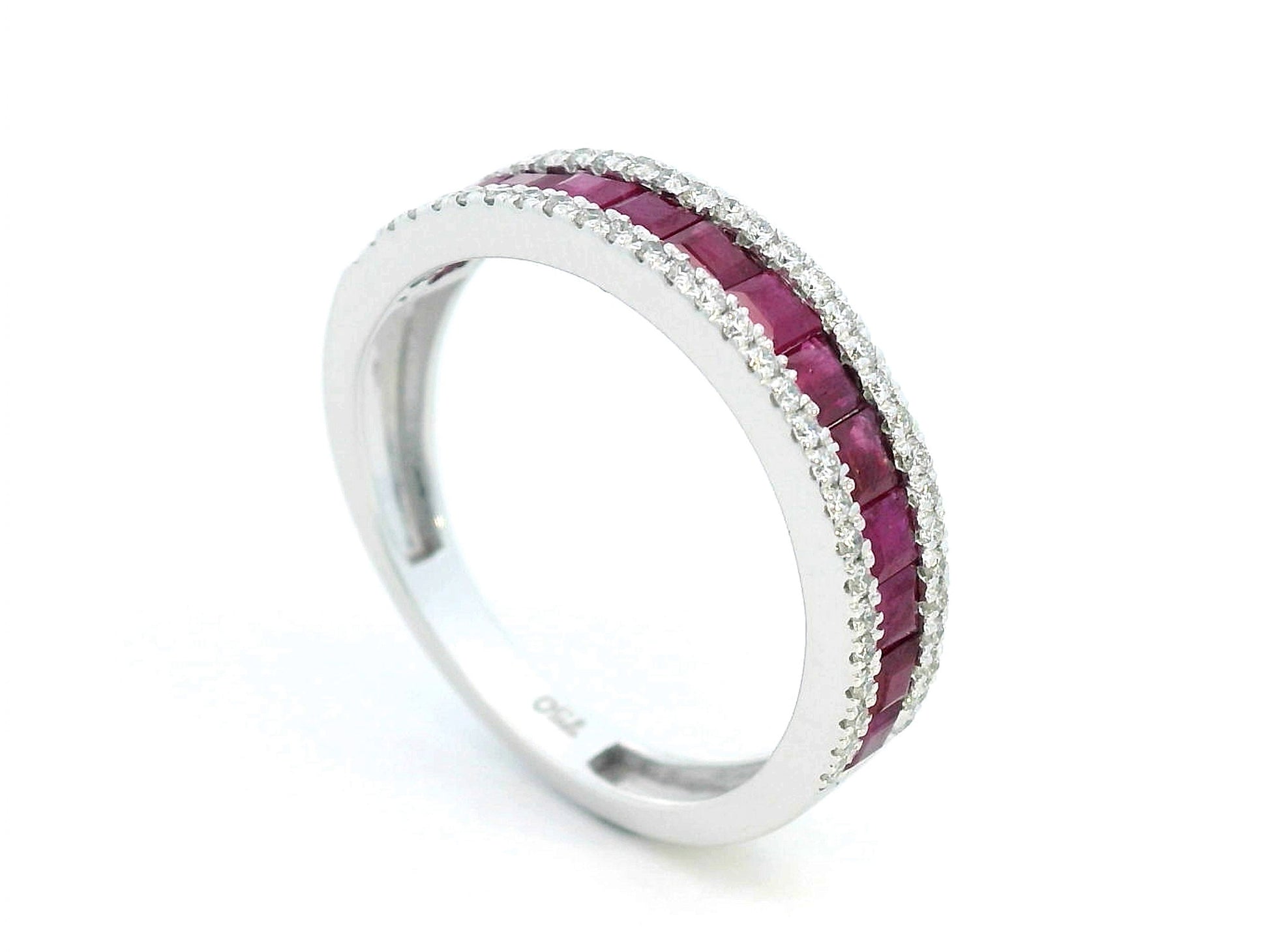18K gold ruby and diamond ring with 1.36ct baguette-cut rubies and 0.26ct round diamonds in modern channel setting.