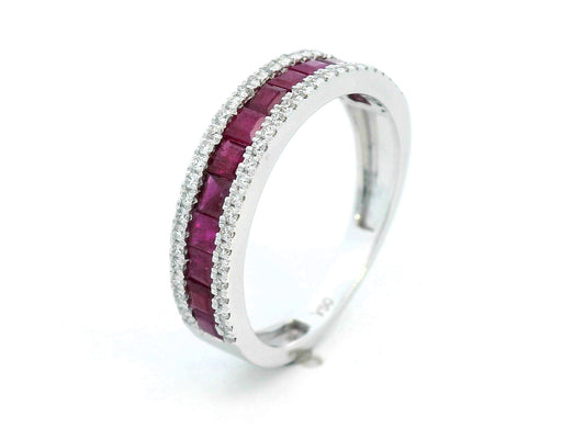 18K gold ruby and diamond ring with 1.36ct baguette-cut rubies and 0.26ct round diamonds in modern channel setting.