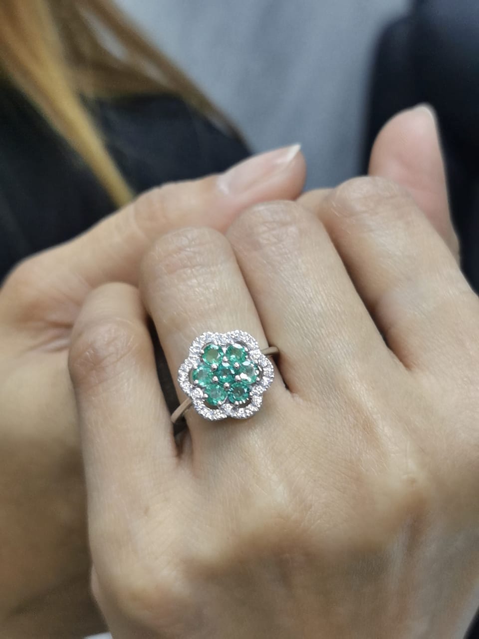 Floral emerald cluster and diamond halo ring in 18K gold

