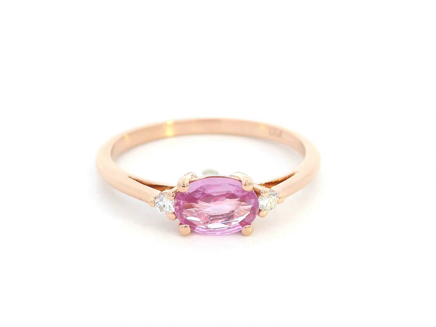 Oval pink sapphire and diamond ring in 18K rose gold

