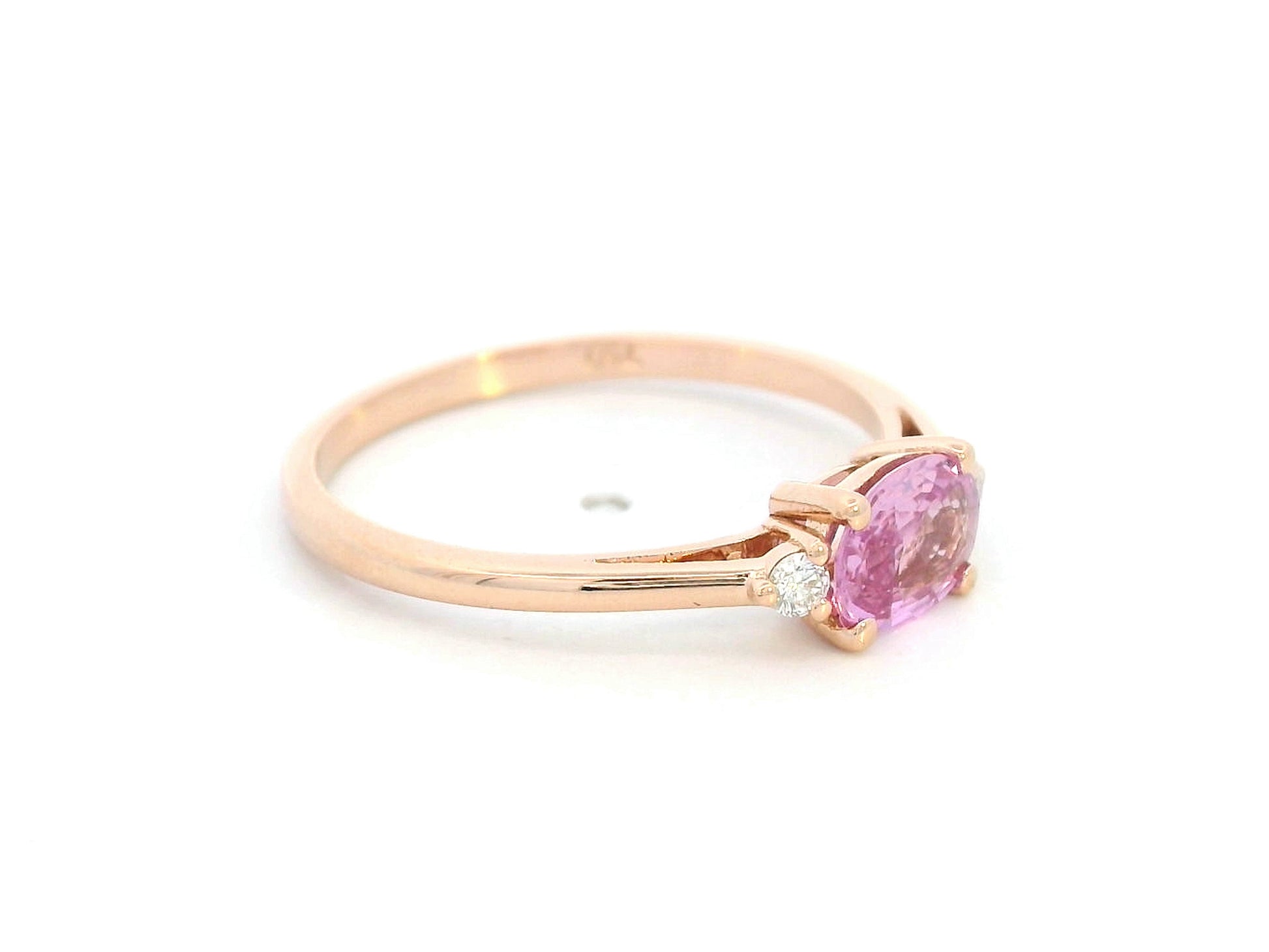 Oval pink sapphire and diamond ring in 18K rose gold

