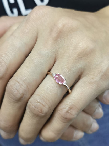 Oval pink sapphire and diamond ring in 18K rose gold

