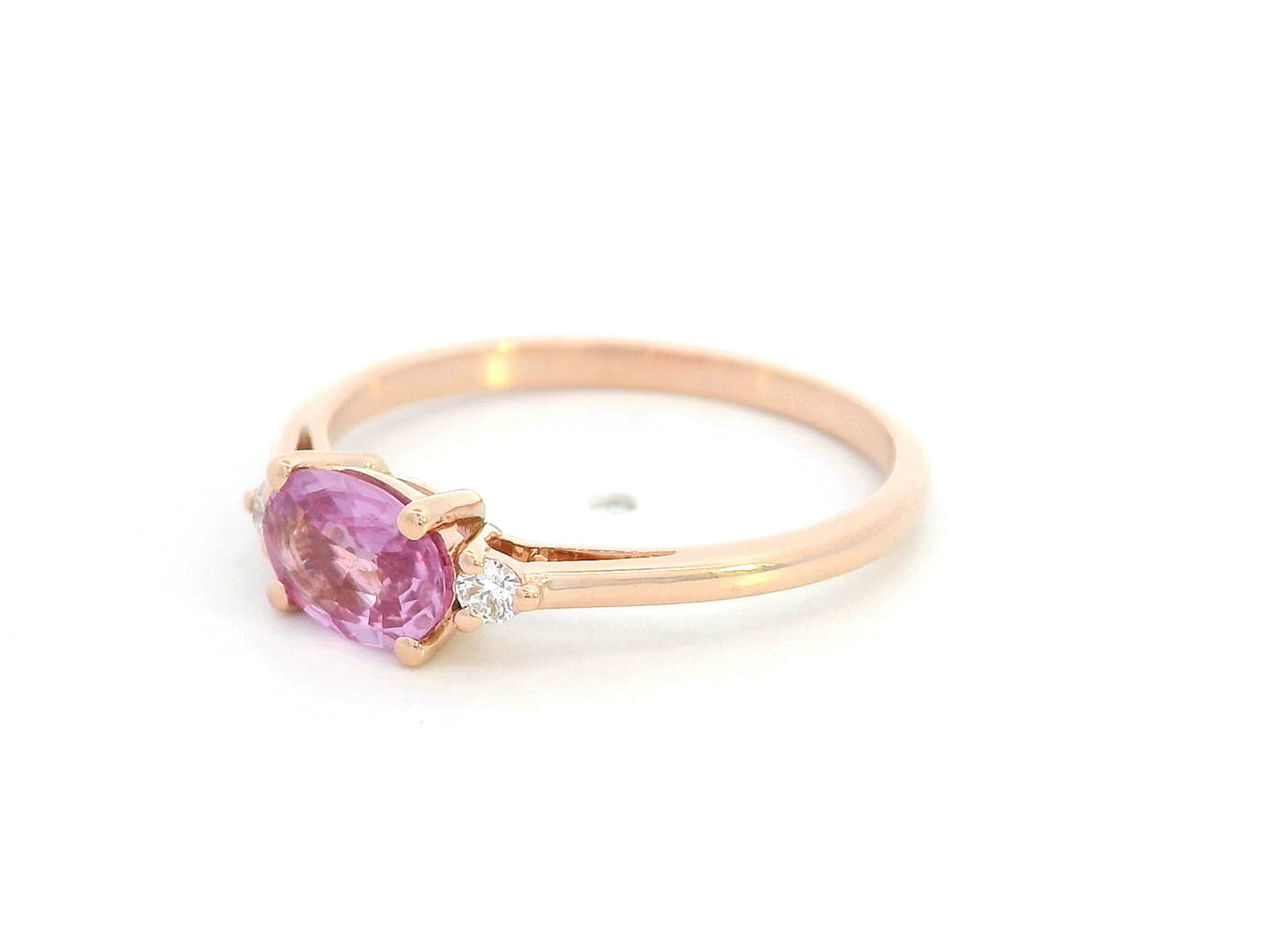 Oval pink sapphire and diamond ring in 18K rose gold

