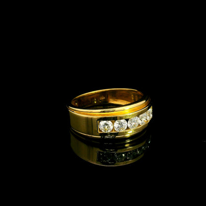 Yellow gold diamond band ring with channel set round diamonds and broad polished gold edges