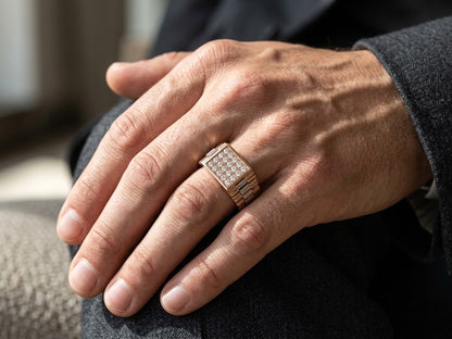 Men’s two tone diamond ring in 18K rose and white gold with a square centre panel set with round brilliant diamonds.