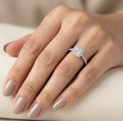 18K white gold princess cut diamond halo engagement ring with a 0.31 carat center diamond and pavé diamond band.