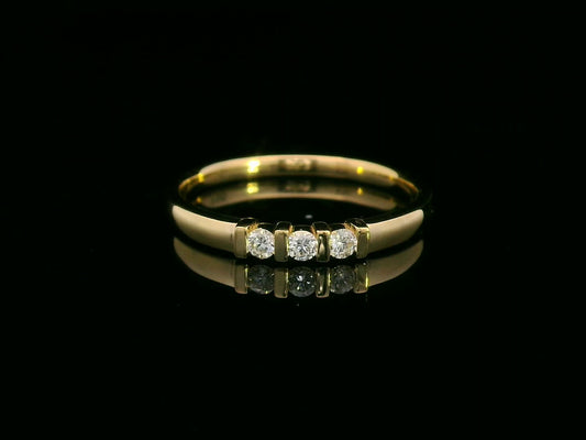 18K yellow gold ring with three round diamonds separated by gold bars – minimalist trilogy design